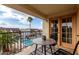 Relaxing balcony showcasing views of the community pool, palm trees, and blue skies at 5518 E Lindstrom Ln # 3012, Mesa, AZ 85215