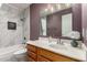 Bright bathroom featuring a shower-tub combination with marble tile surround and a stylish vanity at 5518 E Lindstrom Ln # 3012, Mesa, AZ 85215