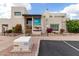 Exterior of the Apache Wells Clubhouse featuring Southwestern architecture and colorful landscaping at 5518 E Lindstrom Ln # 3012, Mesa, AZ 85215