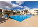 Spacious community pool offers a refreshing retreat, complete with lounge chairs and covered seating areas at 5518 E Lindstrom Ln # 3012, Mesa, AZ 85215