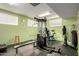 Bright exercise room equipped with universal machine, benches, and rubber flooring at 5518 E Lindstrom Ln # 3012, Mesa, AZ 85215