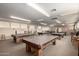 Spacious game room featuring multiple billiard tables and ample lighting throughout at 5518 E Lindstrom Ln # 3012, Mesa, AZ 85215