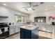 Community kitchen with a large center island, modern appliances, and neutral color palette at 5518 E Lindstrom Ln # 3012, Mesa, AZ 85215