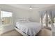 Bright main bedroom with contemporary furnishings and French doors to balcony at 5518 E Lindstrom Ln # 3012, Mesa, AZ 85215