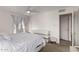 Stylish main bedroom with white furniture, soft lighting, and ensuite access at 5518 E Lindstrom Ln # 3012, Mesa, AZ 85215