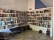 Spacious library filled with bookshelves and a decorative tiled floor at 637 E Kramer St, Mesa, AZ 85203
