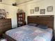 Comfortable main bedroom with a decorative quilt and rustic wooden furniture at 637 E Kramer St, Mesa, AZ 85203
