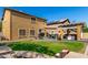 Expansive backyard with lush grass, an outdoor kitchen, covered patio, and shaded dining at 7359 W Kings Ave, Peoria, AZ 85382