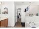 Bright bathroom featuring tiled floors, a walk-in closet, large tub, and a convenient walk-in shower at 7359 W Kings Ave, Peoria, AZ 85382