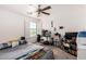 Comfortable bedroom with a ceiling fan and a view of the outdoors, offering a relaxing space at 7359 W Kings Ave, Peoria, AZ 85382