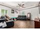 Living room with tile flooring, ceiling fan, recessed lights, neutral paint, and natural light at 7359 W Kings Ave, Peoria, AZ 85382