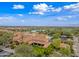 Stunning aerial view showcasing the community's pools, golf course, and beautiful landscaping at 77 E Atole Ct, Queen Creek, AZ 85140
