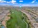 Stunning aerial view of the community golf course, surrounded by beautiful homes and scenic landscapes at 77 E Atole Ct, Queen Creek, AZ 85140