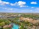 Stunning aerial view featuring pools, manicured grounds, a golf course and luxury residences at 77 E Atole Ct, Queen Creek, AZ 85140
