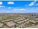Expansive aerial view of a well-planned community with tree-lined streets and beautiful homes, offering a serene Arizona lifestyle at 77 E Atole Ct, Queen Creek, AZ 85140