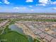 Stunning aerial perspective captures a luxurious golf community with scenic water features and meticulously landscaped properties in Arizona at 77 E Atole Ct, Queen Creek, AZ 85140