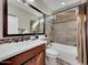 Bright bathroom features a tiled shower/tub combination and a modern vanity with decorative mosaic tile backsplash at 77 E Atole Ct, Queen Creek, AZ 85140
