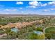 Enjoy resort-style living with community pools, palm trees, and lush landscaping at 77 E Atole Ct, Queen Creek, AZ 85140