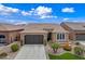 Attractive single-Gathering home featuring a two-car garage and tidy landscaping at 77 E Atole Ct, Queen Creek, AZ 85140