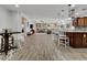 Open-concept living space boasts tiled floors, a dining area, breakfast bar and seamless flow at 77 E Atole Ct, Queen Creek, AZ 85140