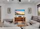 Spacious living room featuring recessed lights, fan, and stylish glass top table at 77 E Atole Ct, Queen Creek, AZ 85140