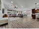 Bright open living space featuring modern wood-look flooring and neutral decor at 77 E Atole Ct, Queen Creek, AZ 85140