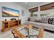 Comfortable living room with large windows, a media center and relaxing couch at 77 E Atole Ct, Queen Creek, AZ 85140