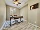 Cozy office space with tiled floors, a ceiling fan, a window, and neutral paint at 77 E Atole Ct, Queen Creek, AZ 85140