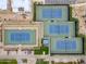 Aerial view of tennis courts surrounded by lush landscaping at 77 E Atole Ct, Queen Creek, AZ 85140