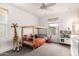 Bright bedroom featuring a platform bed, plush carpet, and a cute stuffed animal at 8336 E Idaho Ave, Mesa, AZ 85209