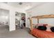 Bright bedroom featuring a platform bed, plush carpet, and closet storage at 8336 E Idaho Ave, Mesa, AZ 85209