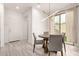Dining area with stylish lighting and sliding glass doors at 8336 E Idaho Ave, Mesa, AZ 85209