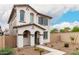 Inviting two-story home featuring desert landscaping and neutral colors at 8336 E Idaho Ave, Mesa, AZ 85209