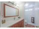 Modern bathroom featuring a quartz countertop, wood vanity, and tiled step-in shower at 8379 E San Salvador Dr, Scottsdale, AZ 85258
