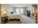 Bright bedroom features plush carpet, neutral walls, and a ceiling fan for added comfort at 8379 E San Salvador Dr, Scottsdale, AZ 85258