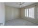 Neutral bedroom with a ceiling fan and carpet flooring, offering a serene retreat at 8379 E San Salvador Dr, Scottsdale, AZ 85258
