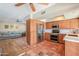 Open concept kitchen with stainless steel appliances, tile floors, and a seamless flow to the living area at 8379 E San Salvador Dr, Scottsdale, AZ 85258