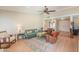 Bright and spacious living room with comfortable seating, ceiling fan, and stylish decor at 8379 E San Salvador Dr, Scottsdale, AZ 85258
