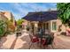 A private backyard patio featuring a fire pit, and cozy seating, perfect for entertaining at 9442 N 106Th Pl, Scottsdale, AZ 85258