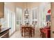 Sunlit dining area featuring a charming table set and stylish window shutters at 9442 N 106Th Pl, Scottsdale, AZ 85258