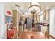 Eat-in kitchen featuring ample counter space, stainless appliances, and a decorative chandelier over a dining table at 9442 N 106Th Pl, Scottsdale, AZ 85258