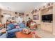 Open-concept living area with plenty of natural light, comfortable seating, and western-style decor at 9442 N 106Th Pl, Scottsdale, AZ 85258