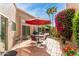 Outdoor patio area with lush landscaping and comfortable seating, ideal for outdoor dining at 9442 N 106Th Pl, Scottsdale, AZ 85258