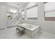Beautiful primary bathroom features a soaking tub, dual sinks, and natural lighting at 10778 N 137Th St, Scottsdale, AZ 85259