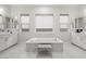 Luxurious bathroom features a soaking tub, dual sinks, and a beautiful marble tile surround at 10778 N 137Th St, Scottsdale, AZ 85259