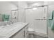 Stylish bathroom featuring a walk-in shower with glass door, modern fixtures, and elegant quartz countertop at 10778 N 137Th St, Scottsdale, AZ 85259