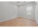Clean bedroom with hardwood floors, window and a ceiling fan at 10778 N 137Th St, Scottsdale, AZ 85259