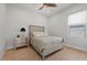Cozy bedroom with a comfortable bed, elegant mirrored nightstand, and a bright window at 10778 N 137Th St, Scottsdale, AZ 85259