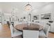 Bright dining area with modern lighting with easy access to the kitchen at 10778 N 137Th St, Scottsdale, AZ 85259