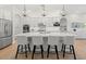 Gourmet kitchen with oversized island, pendant lighting, and stainless steel appliances at 10778 N 137Th St, Scottsdale, AZ 85259